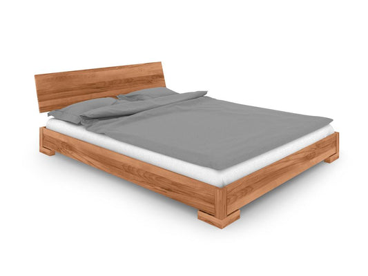 Low bed with headboard in natural oiled beech heartwood 160x200