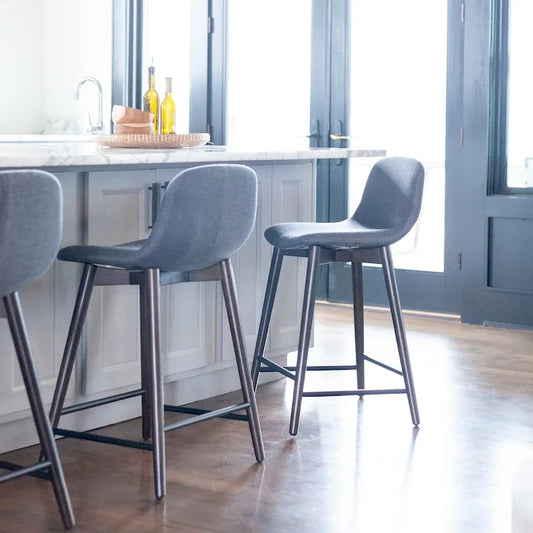 Upholstered Solid Wood Counter Stool With Footrest by East at Main